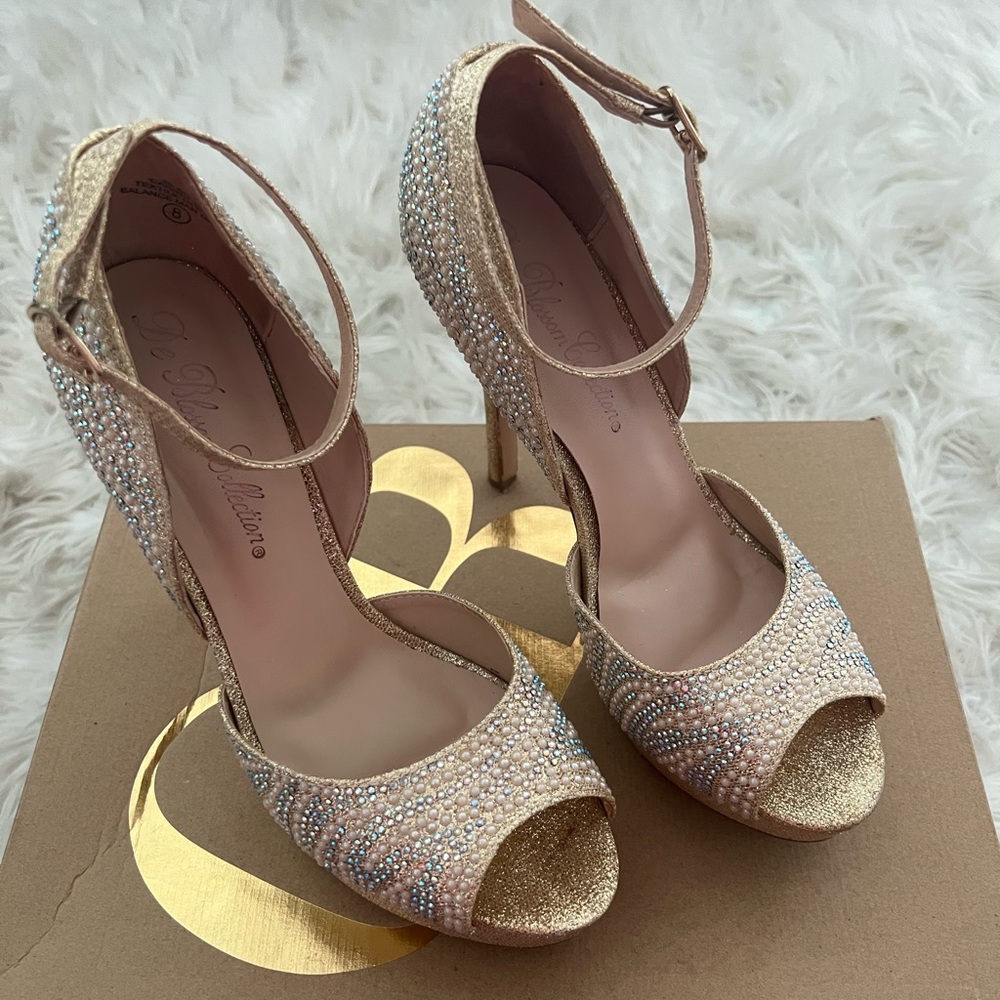 Beautiful pair of champagne heels decorated with rhinestones for special days